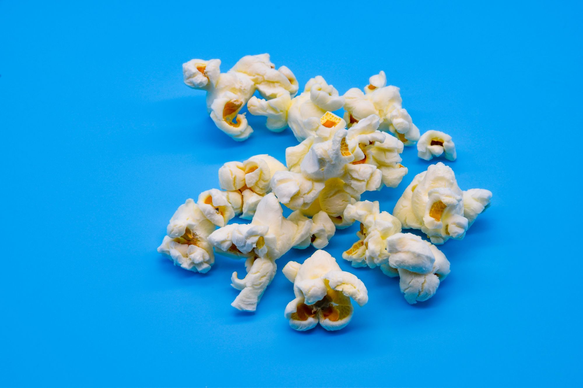 pieces of popcorn on a blue background